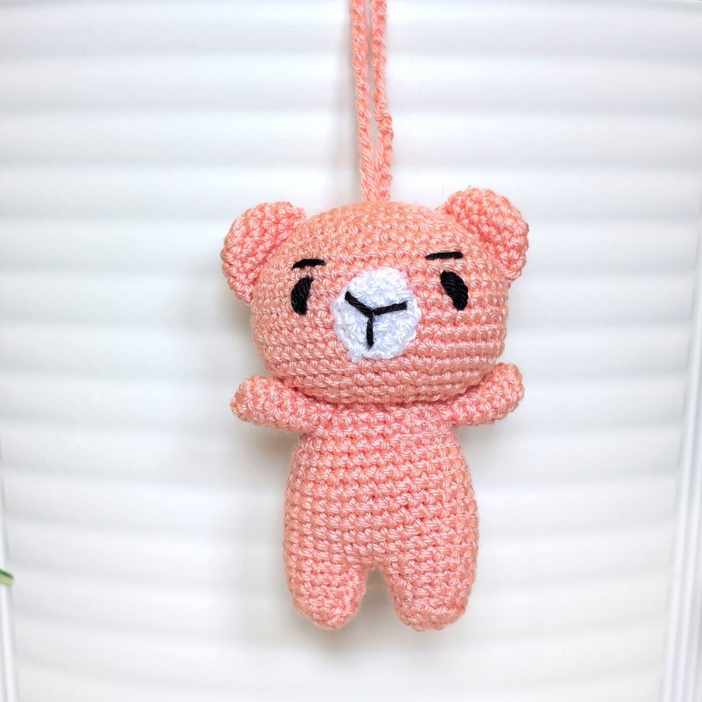 Coral pink crocheted mini teddy bear bag charm with string