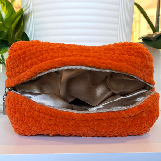 Crochet orange cosmetic bag with copper satin lining