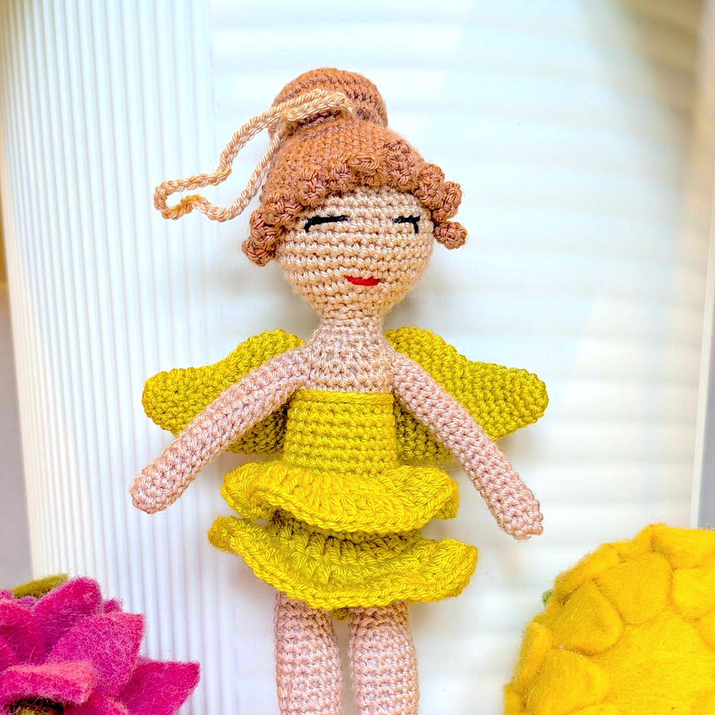 Crocheted plush fairy ballerina doll with chartreuse dress and auburn hair in a bun