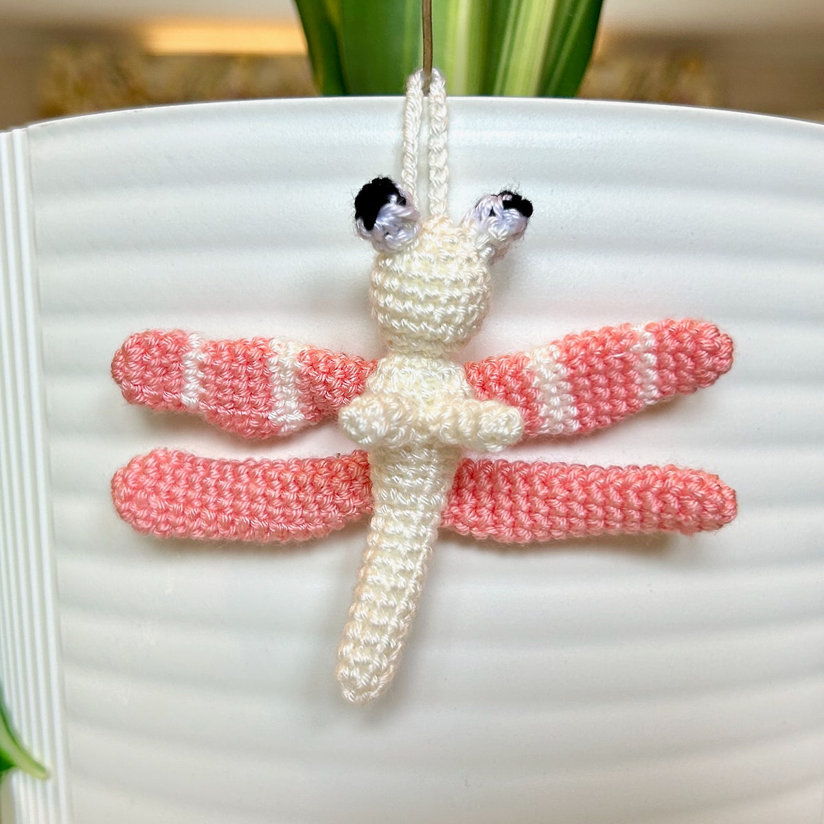 Mini crocheted melon and cream dragonfly charm