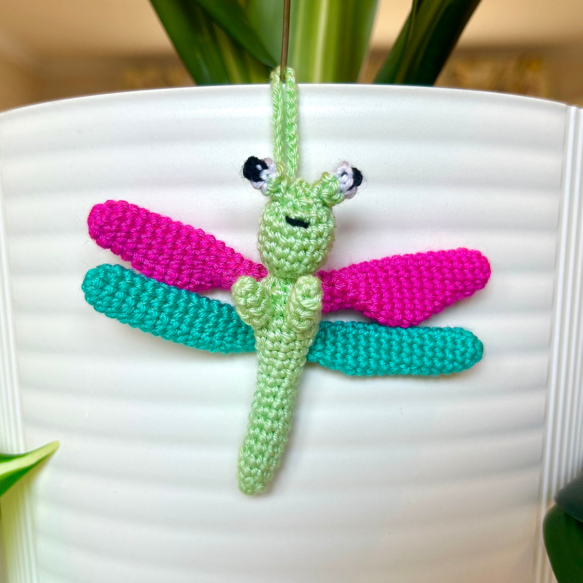 Mini crocheted mint green with hot pink and teal dragonfly charm