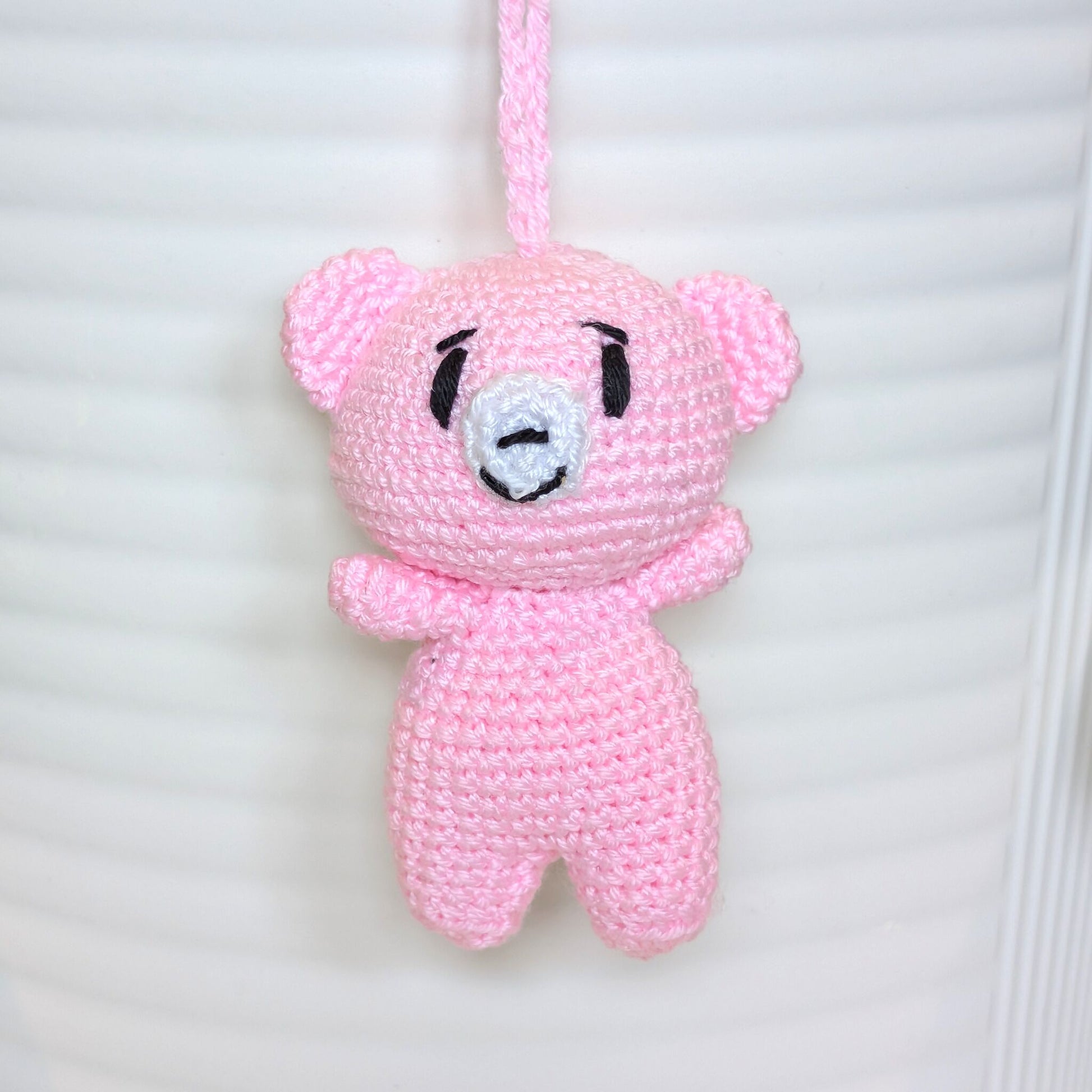 Light pink crocheted mini teddy bear bag charm with string