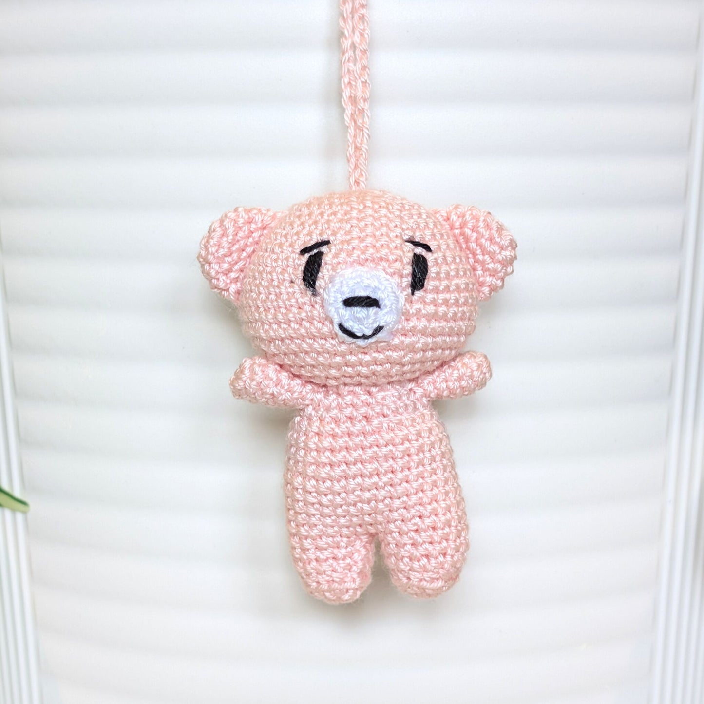 Soft melon colored crocheted mini teddy bear bag charm with string