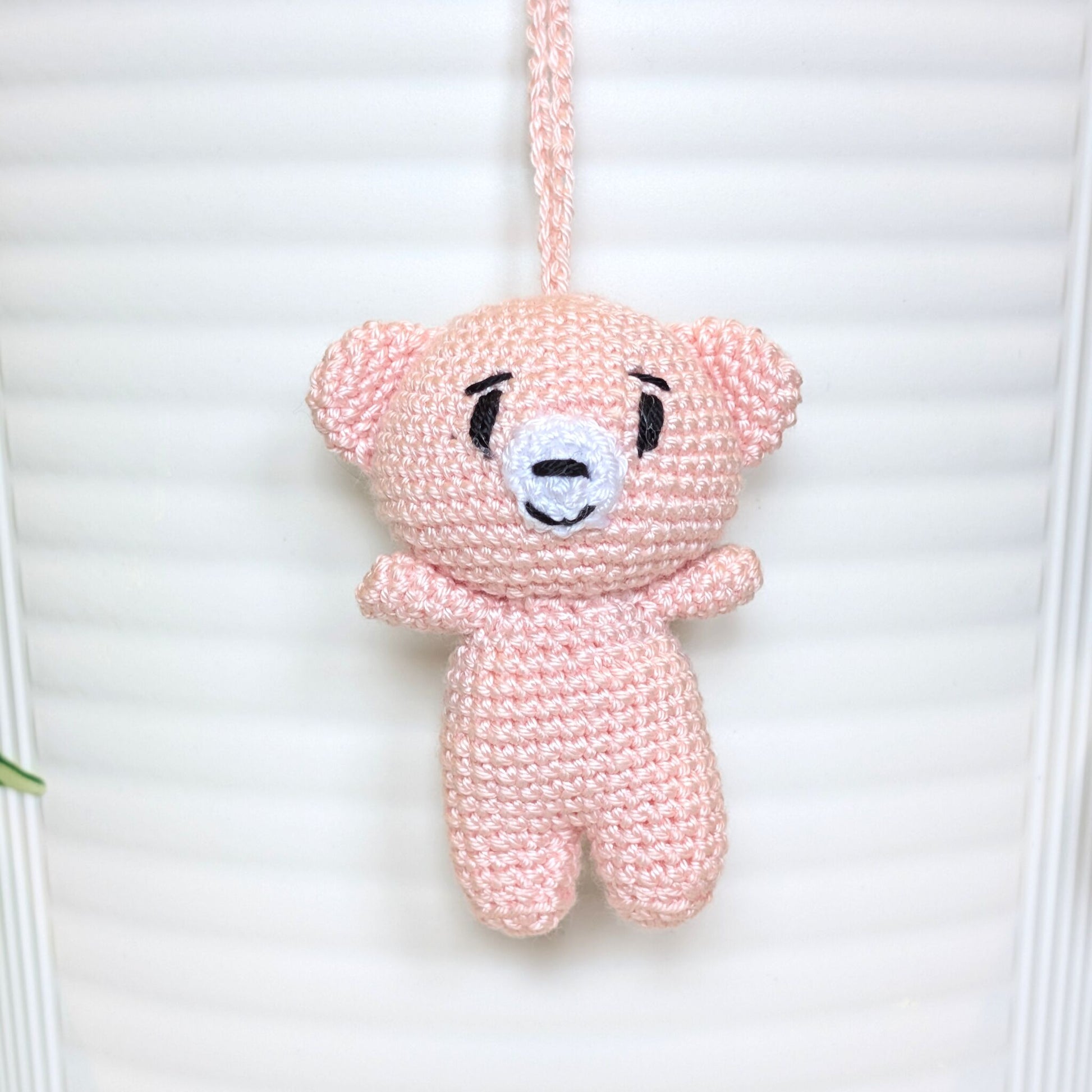 Soft melon colored crocheted mini teddy bear bag charm with string