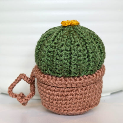 Crocheted moon cactus in a blush brown pot and with a string
