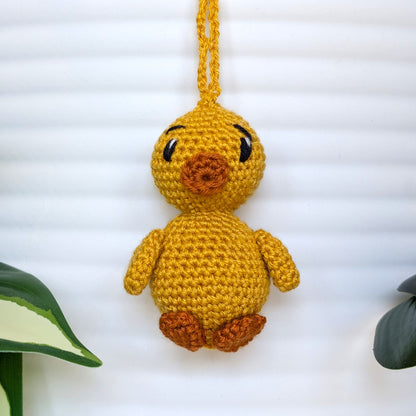 Crocheted golden yellow duck bag charm with string