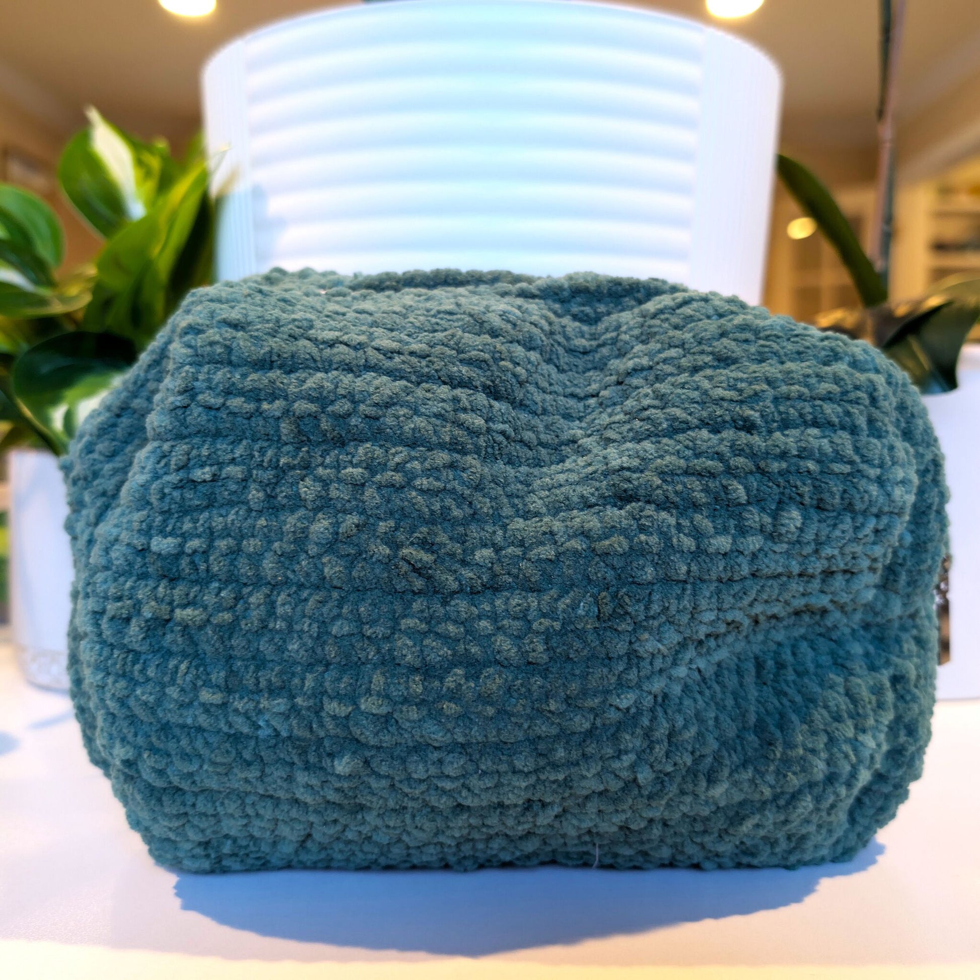 Crocheted forest green cosmetic bag 