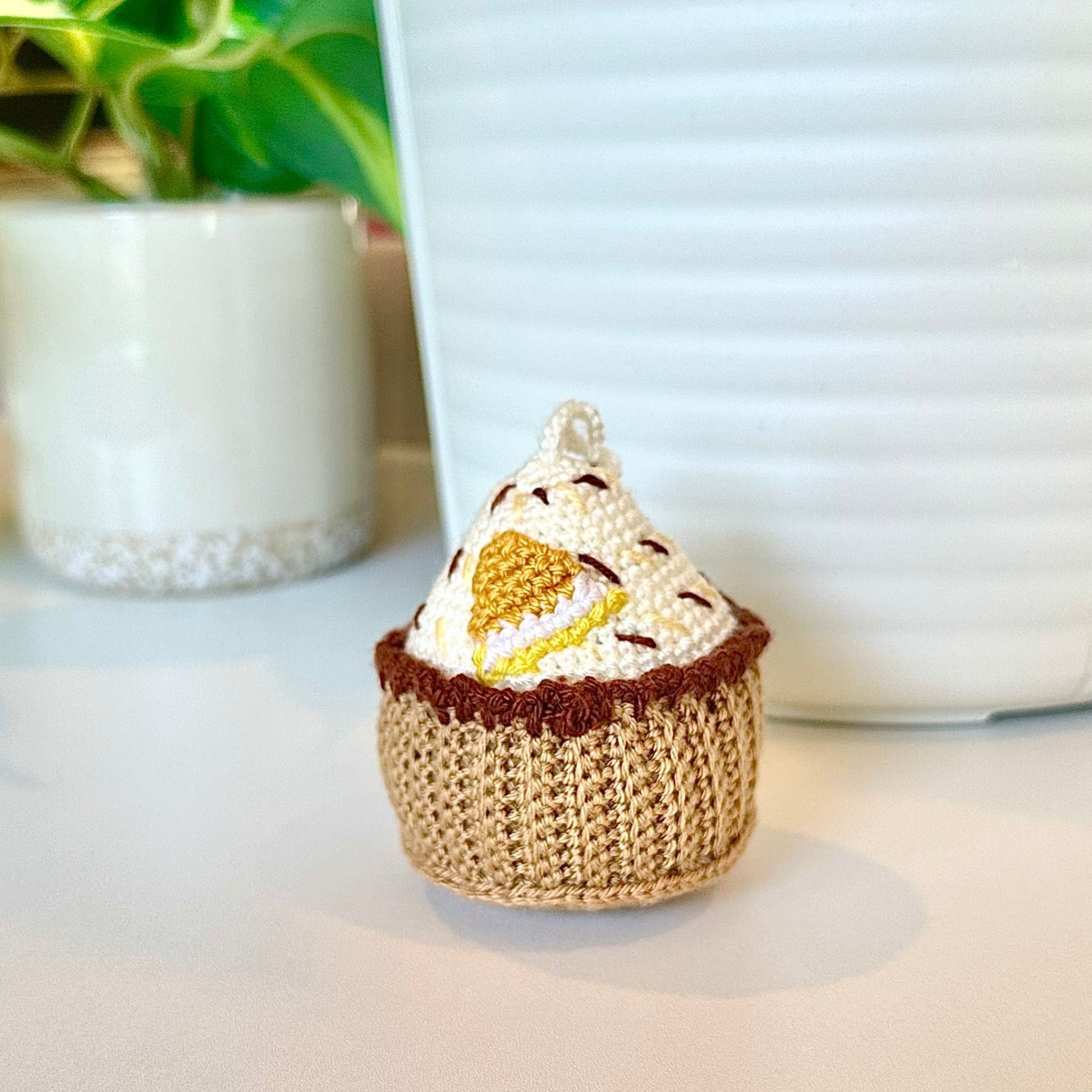 Crocheted lemon cupcake keychain bag charm with a string 