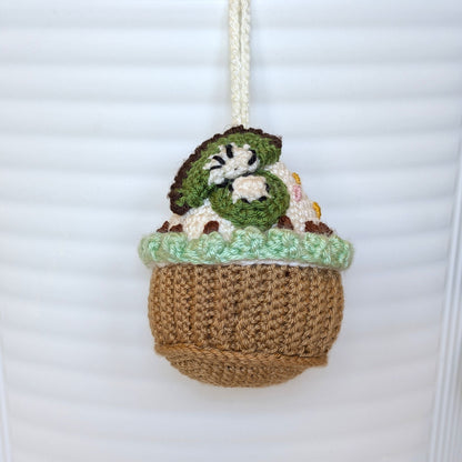 Crocheted kiwi cupcake keychain bag charm with a string 