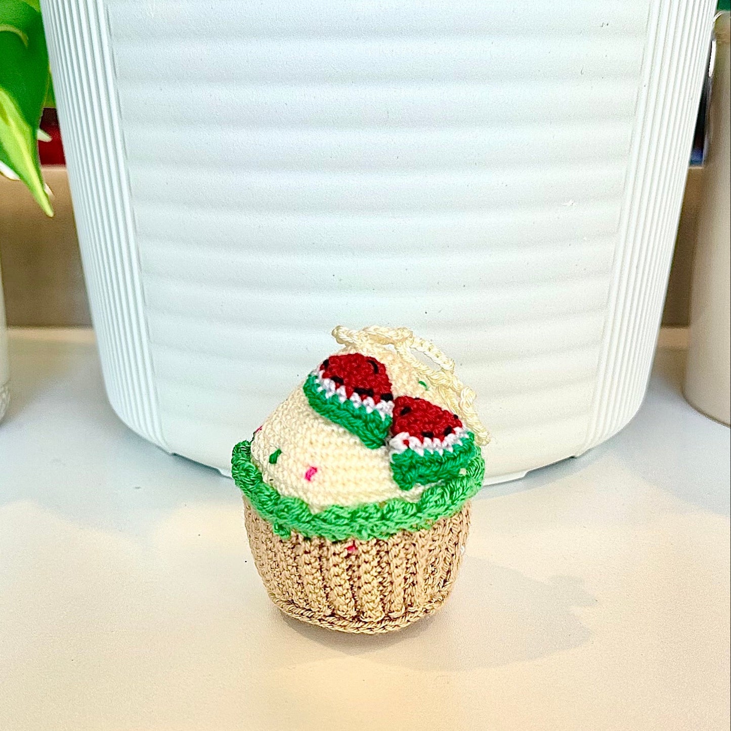 Crocheted watermelon cupcake keychain bag charm with a string 