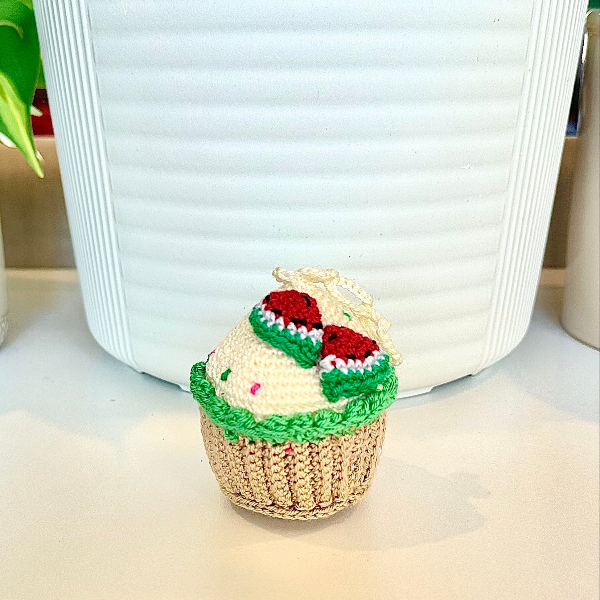 Crocheted watermelon cupcake keychain bag charm with a string 