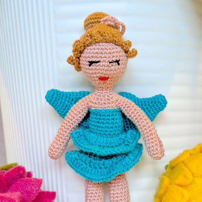 Crocheted plush fairy ballerina doll with a turquoise dress and golden hair in a bun