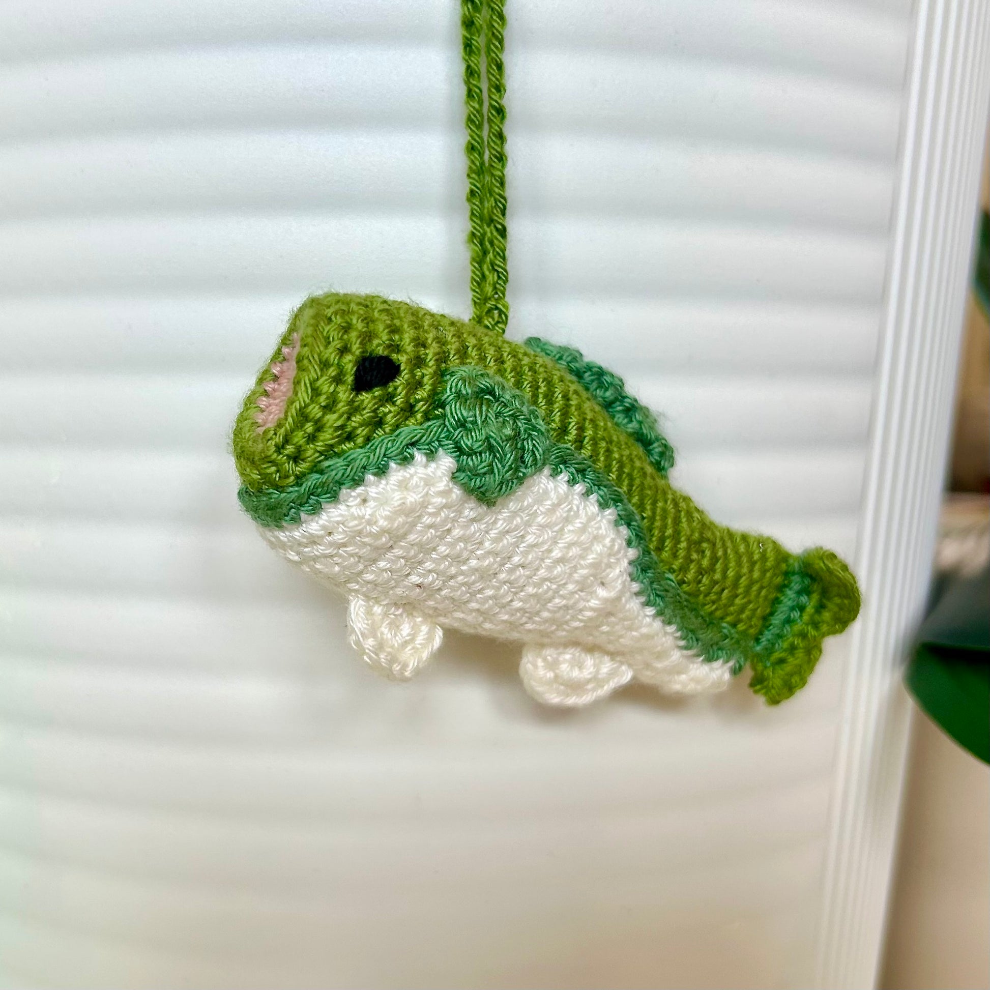 Crocheted bass fish charm in moss and dark sage green