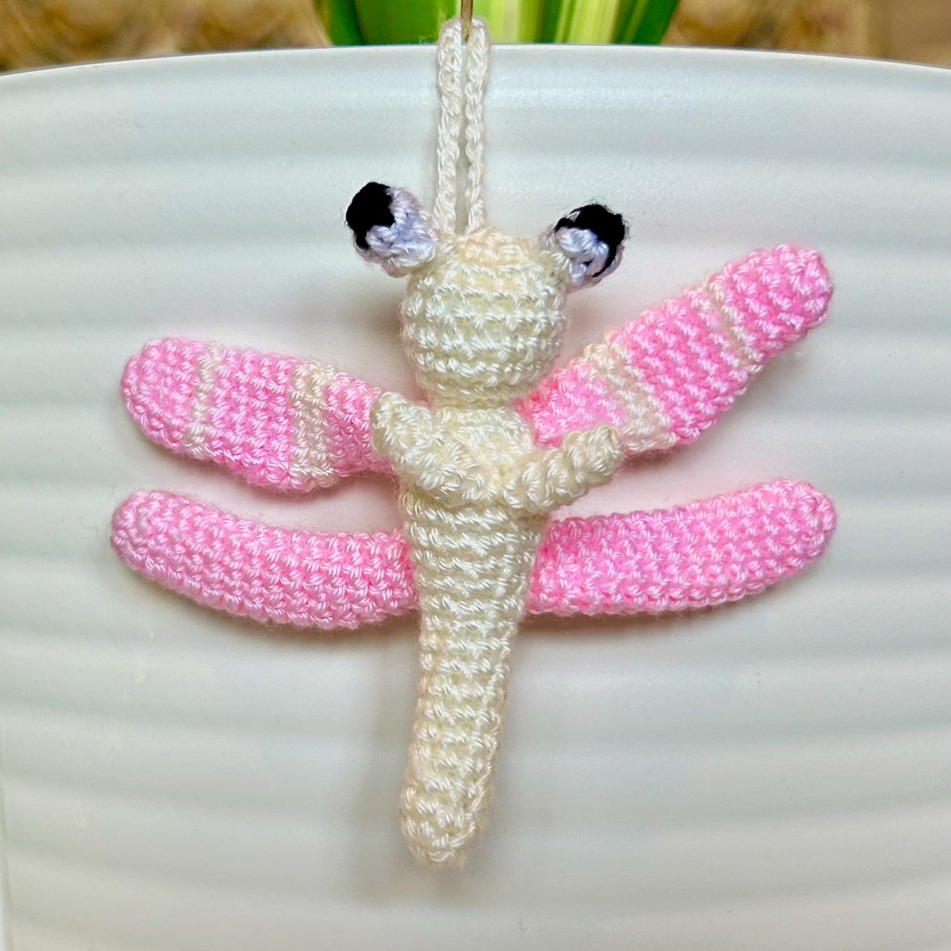 Mini crocheted pink and cream dragonfly charm 
