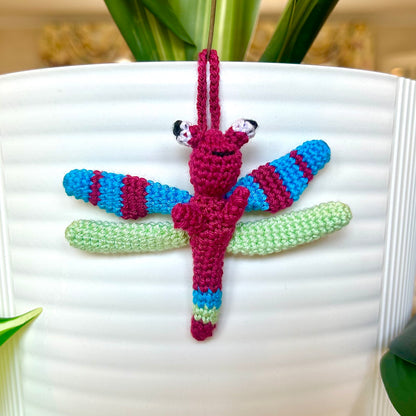 Mini crocheted dragonfly charm with berry, azure, and mint green stripes