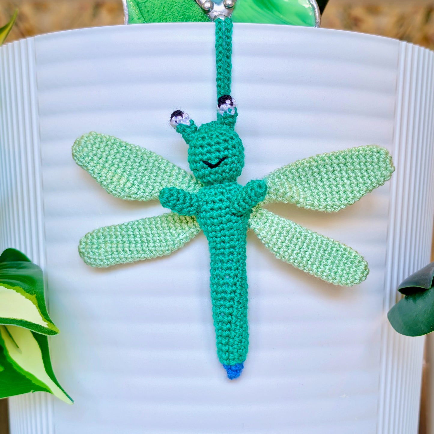 Small crocheted teal dragonfly bag charm with mint green wings