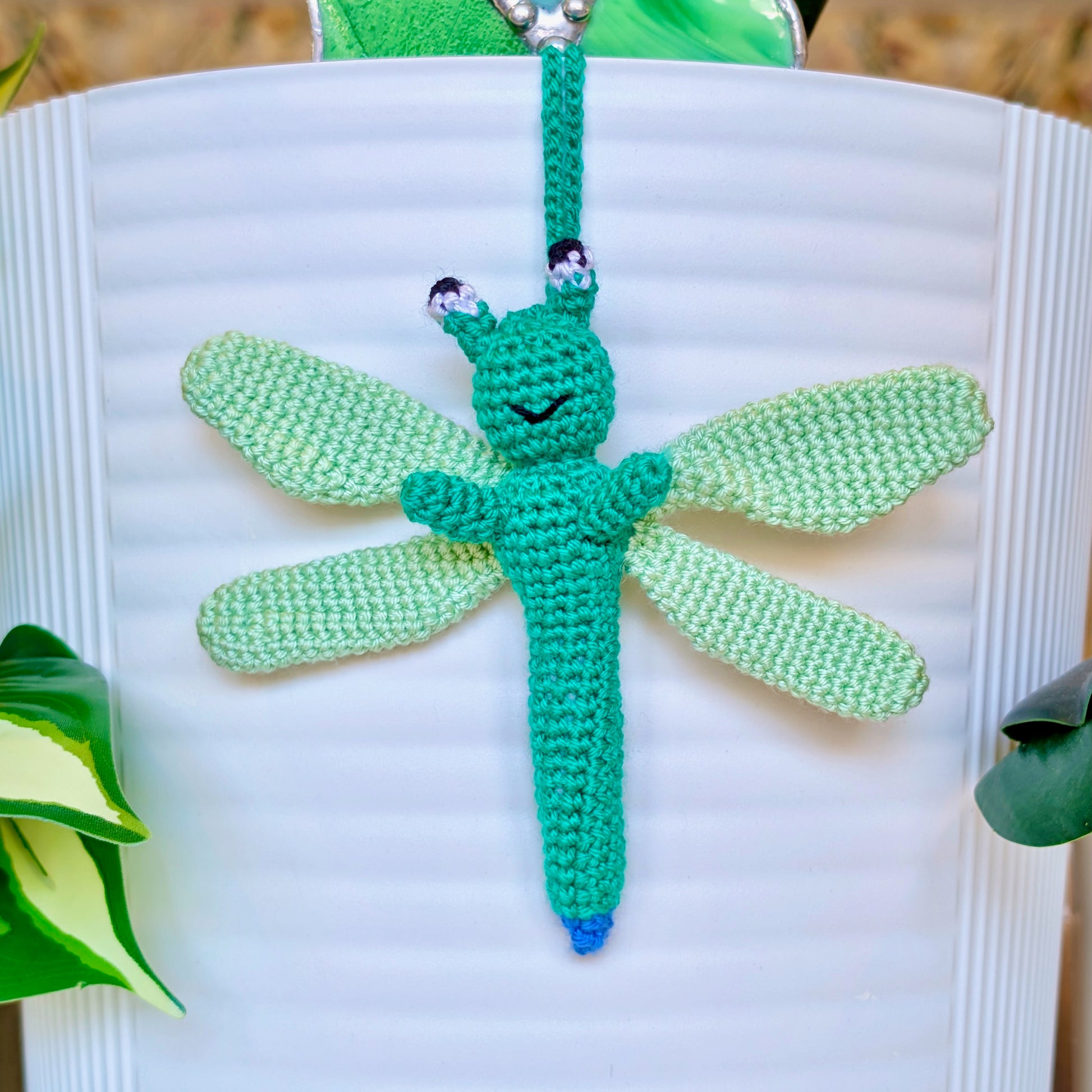 Small crocheted teal dragonfly bag charm with mint green wings