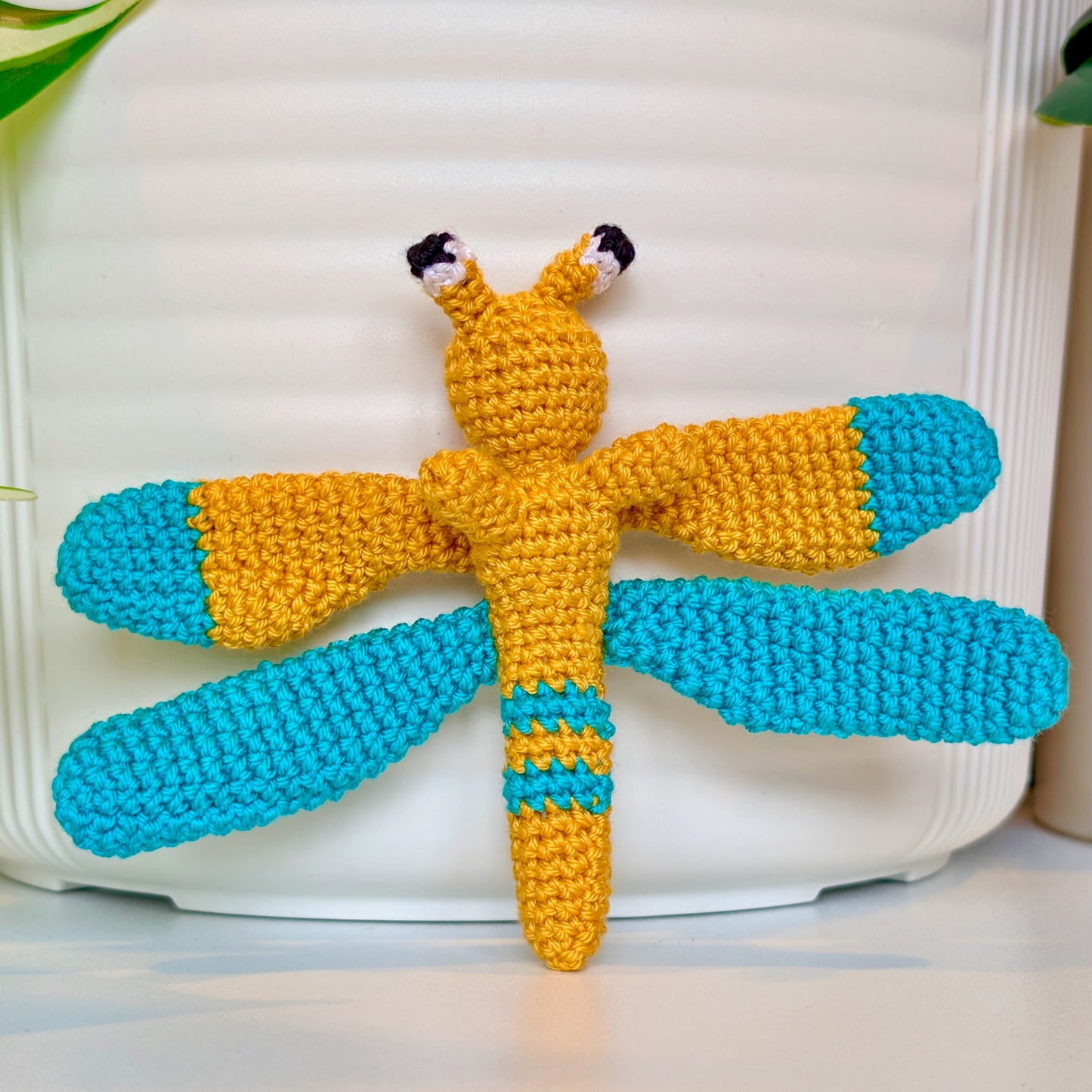 Small crocheted gold and teal dragonfly figurine