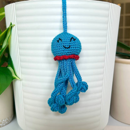 Crocheted azure octopus charm with red trim