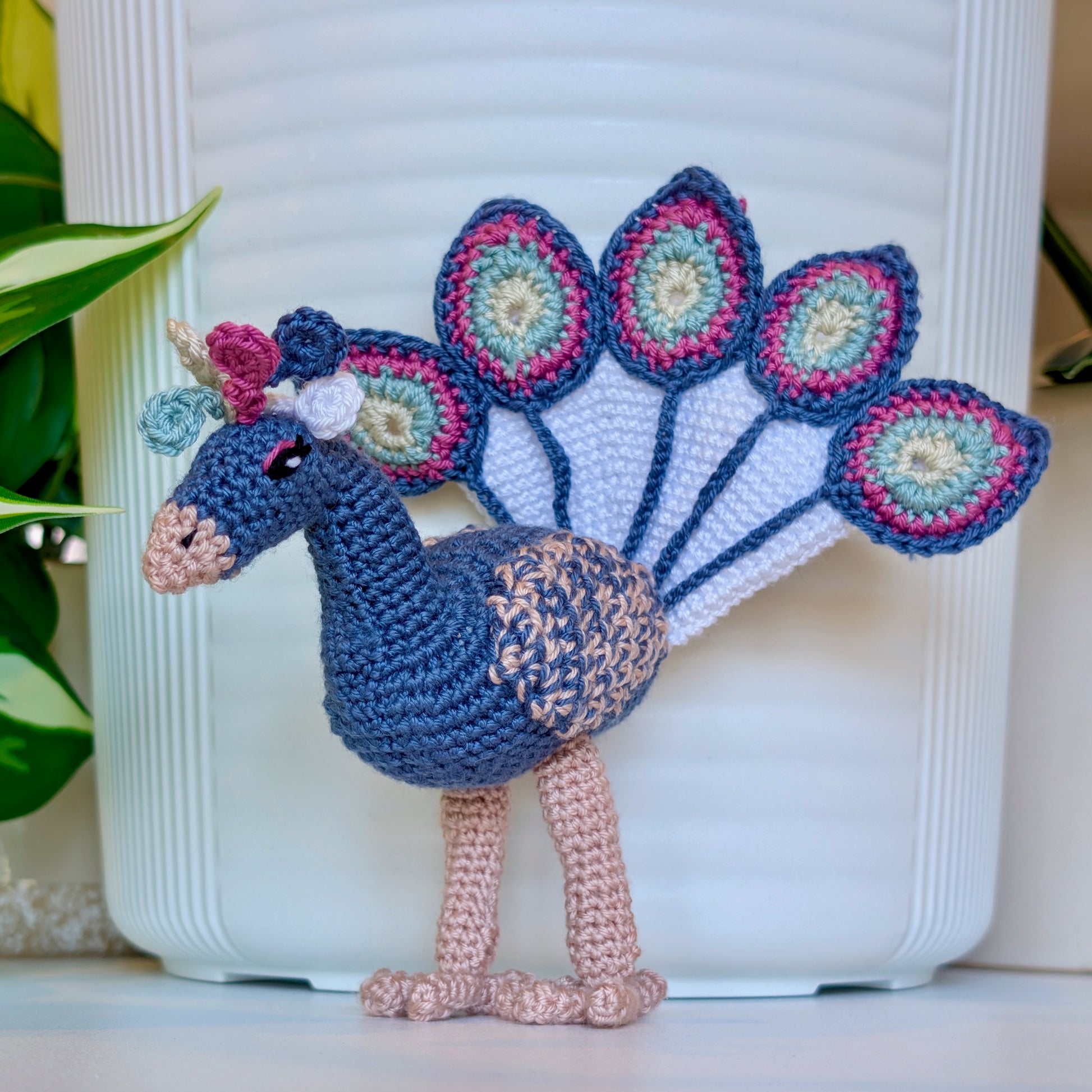 Crocheted peacock in steel blue gray with Wild Orchid and Seafoam accents