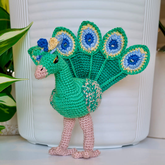 emerald green crocheted peacock with Jade Green, Light Blue, and Creme Brulee colored accents