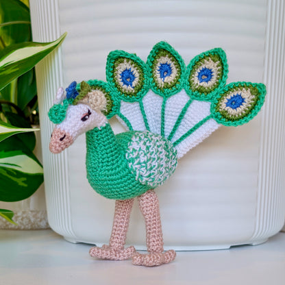 crochet peacock in emerald green with white, Moss Green, and Steel Blue accents