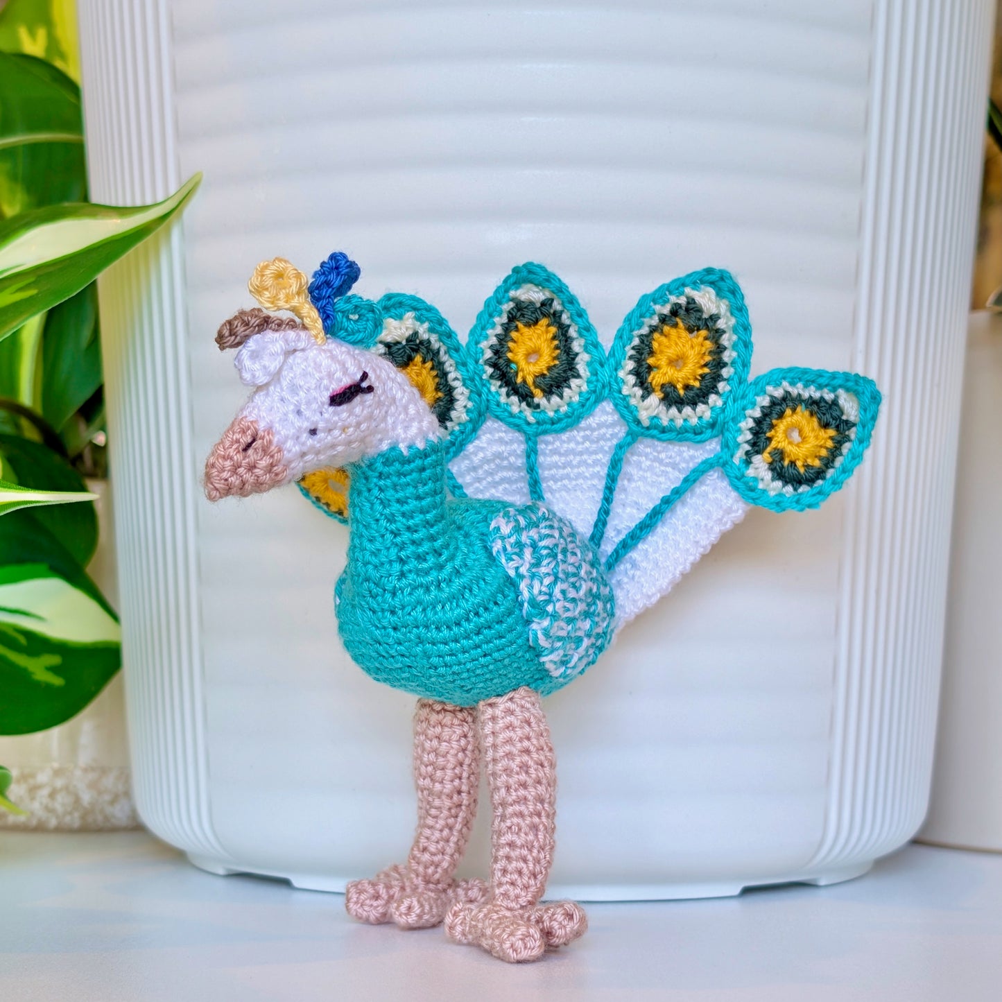 Turquoise crochet peacock with White, Evergreen, and sunflower Yellow accents