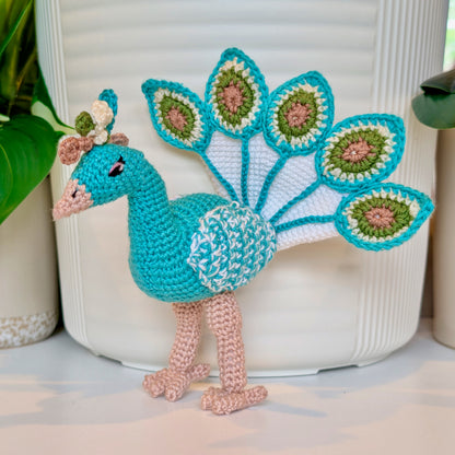 Turquoise crocheted peacock with White, Moss Green, and Dusty Rose accents