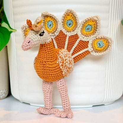 Golden colored crochet peacock with Limestone, Sunflower yellow, Seafoam accents