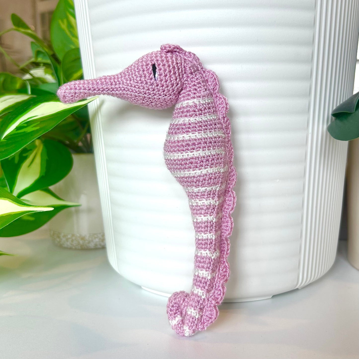 Crocheted light orchid seahorse figurine with white stripes