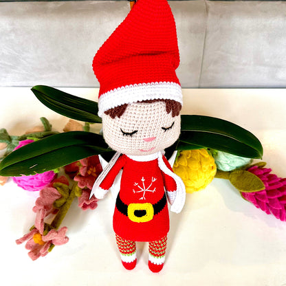 Crocheted plush elf doll in red at and outfit.  