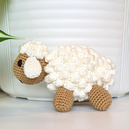 Crocheted cream fleece sheep plush with dark beige body