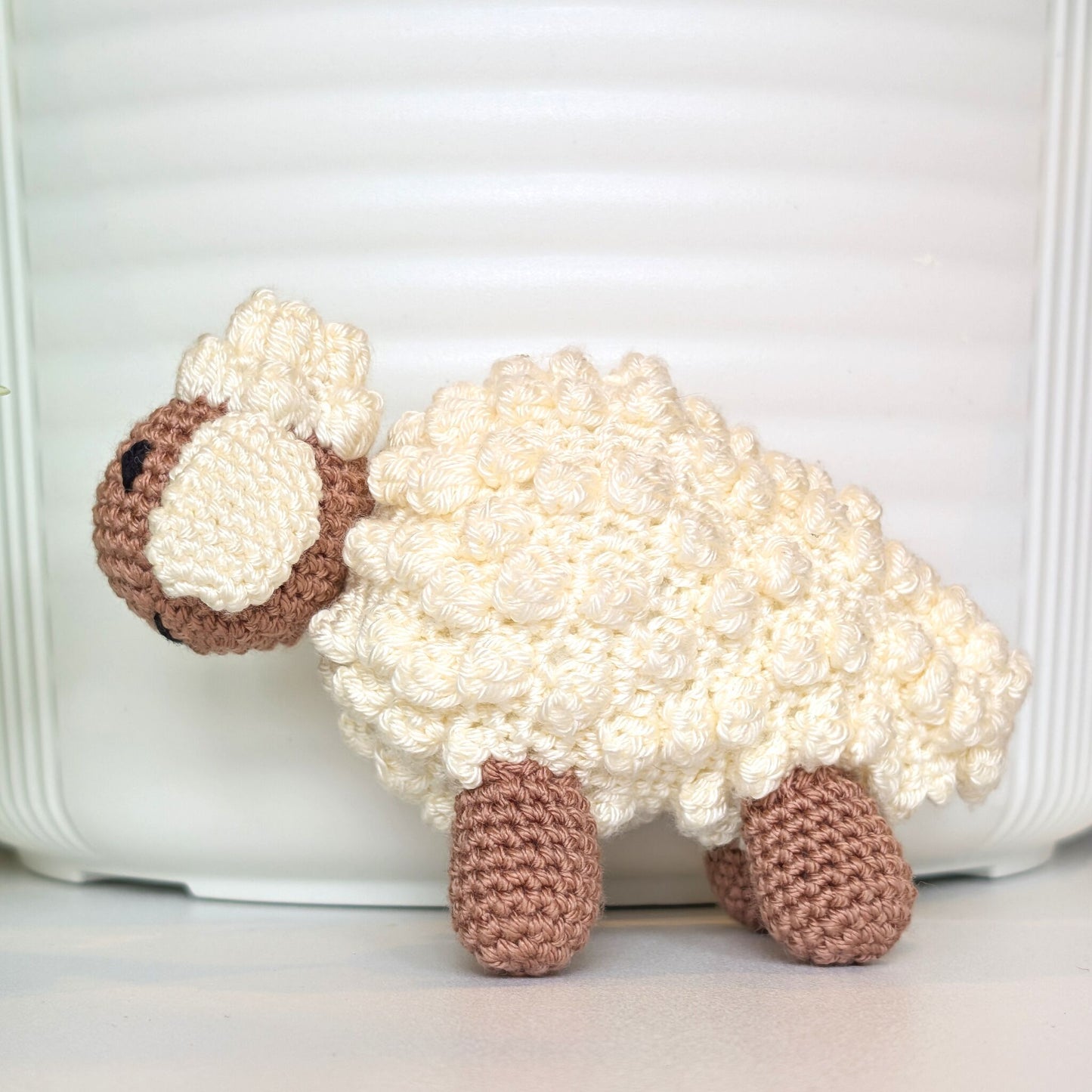 Crocheted cream fleece sheep plush with oatmeal body