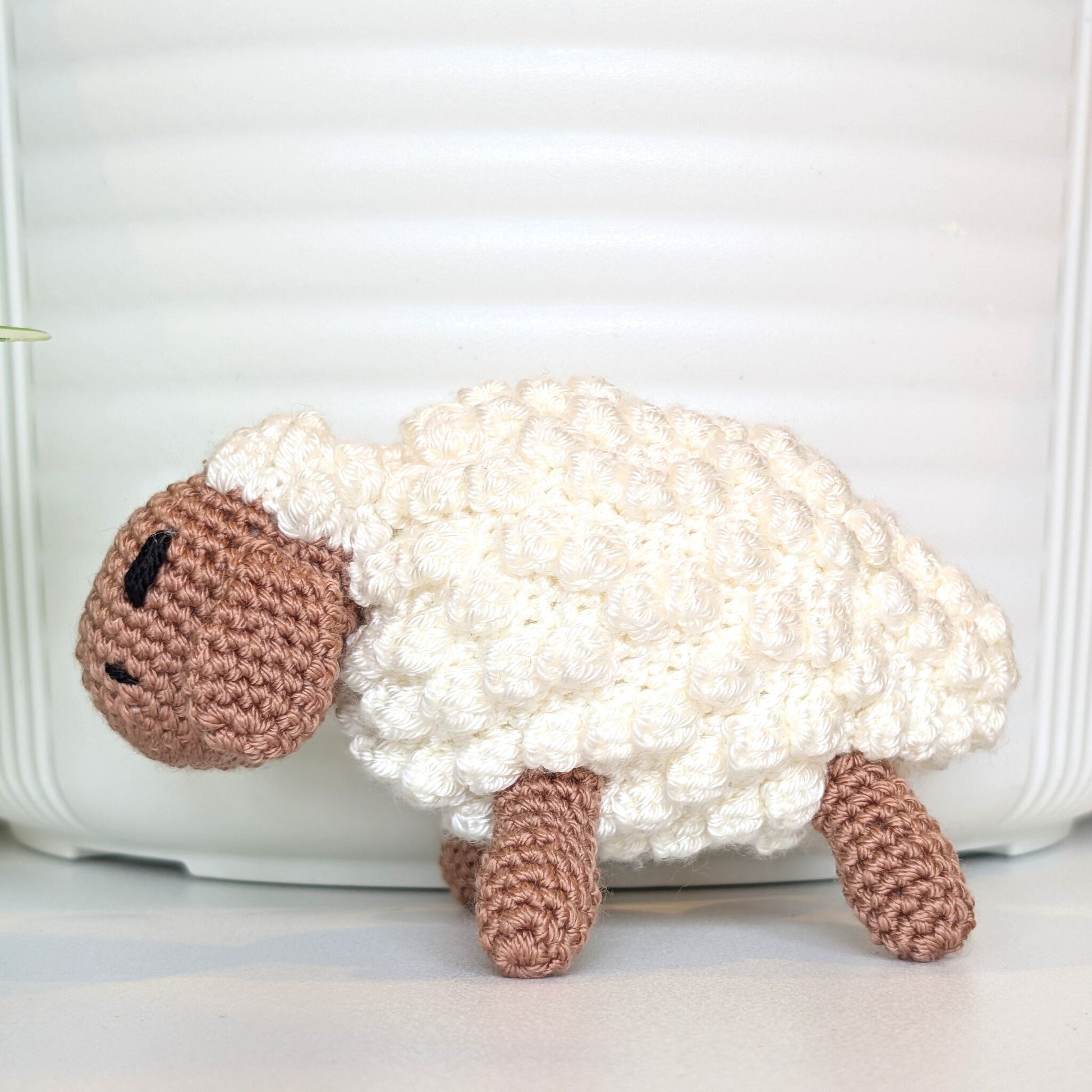 Crocheted sheep plush with oatmeal body