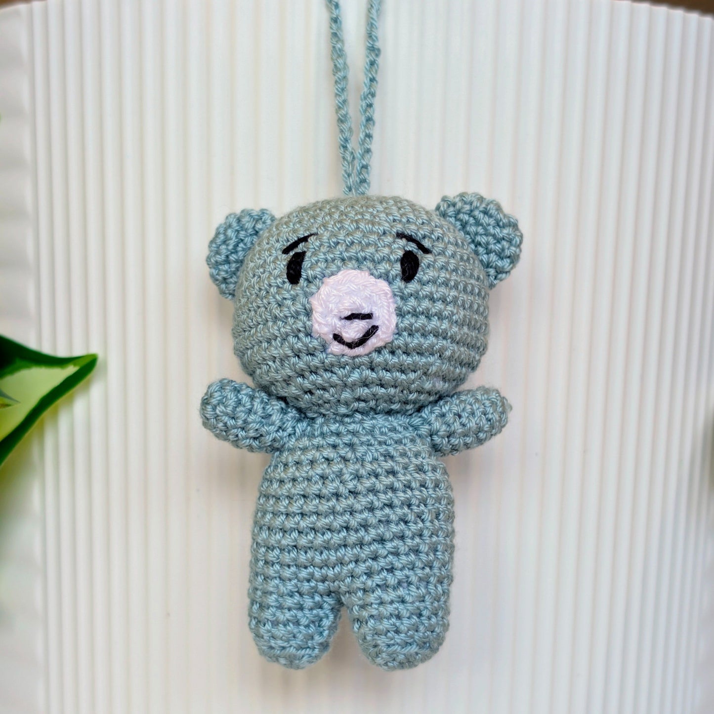Seafoam blue colored crocheted mini teddy bear bag charm with string