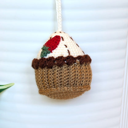 Strawberry topped handmade crochet cupcake keychain charm or an ornament.