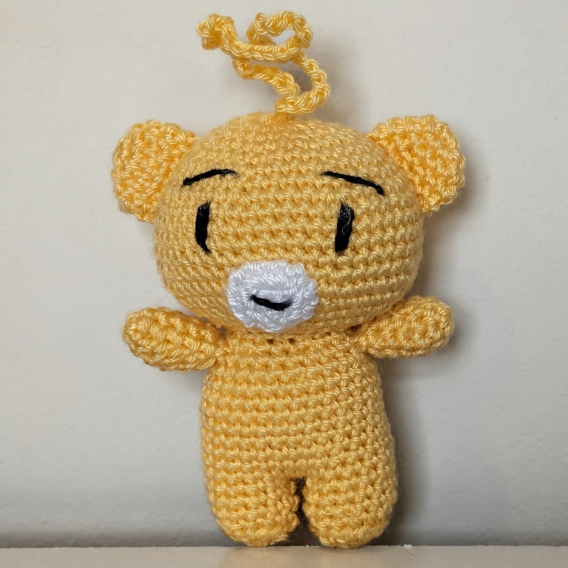 Creme brulee colored crocheted mini teddy bear bag charm with string